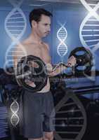 Athletic fit man lifting weights in gym with genetic biology health interface