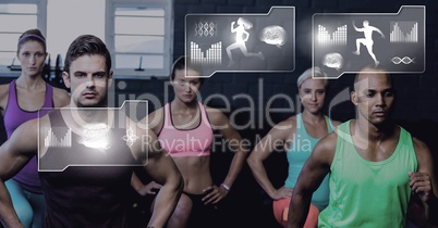 Athletic fit group of people in gym with health interface