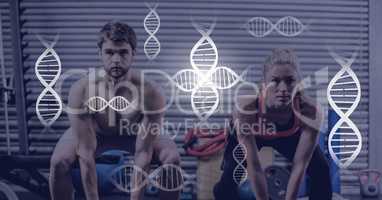 Athletic fit couple in gym with genetic biology interface