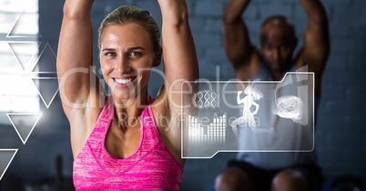 Athletic fit woman in gym with health interface