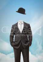 Headless man with surreal floating hat in front of sky