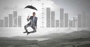 Man floating with umbrella and bar charts over nature landscape