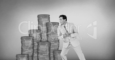 Businessman leaning against money