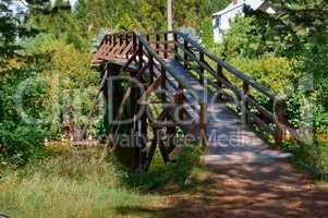 wooden bridge over the stream in the forest, wooden decorative bridge for tourists
