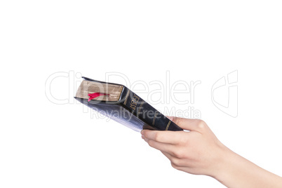 Woman hand holding the Holy Bible