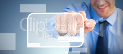 Composite image of friendly businessman pointing at the camera