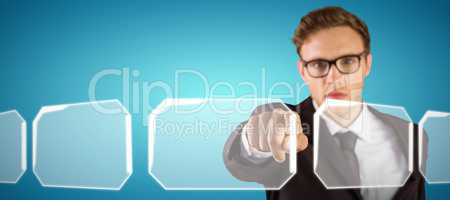 Composite image of young serious businessman pointing at camera