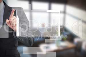Composite image of businessman pointing his finger at camera