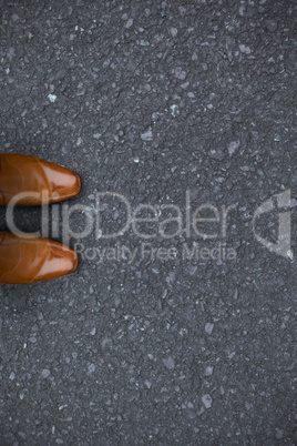 Composite image of focus of brown dress shoes