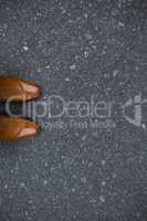 Composite image of focus of brown dress shoes