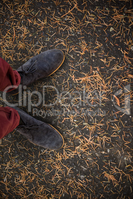 Composite image of high angle view of man wearing shoes