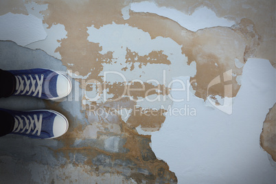 Composite image of high angle view of person wearing canvas shoes