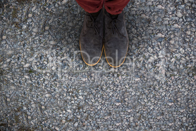 Composite image of casual legs in leather shoes