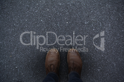 Composite image of feet of man wearing shoes