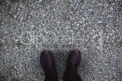 Composite image of close-up of black boots