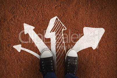 Composite image of businessman wearing canvas shoes standing against white background