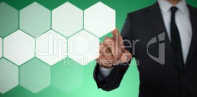 Composite image of mid section of businessman with pointing gesture