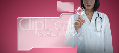 Composite image of mid section of female doctor touching invisible screen