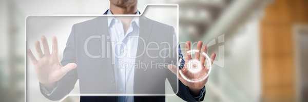 Composite image of businessman touching the invisible screen