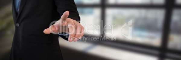 Composite image of mid section of businessman in suit using invisible interface