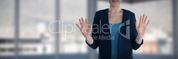 Composite image of mid section of smiling businesswoman gesturing