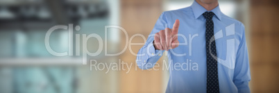 Composite image of mid section of smiling businessman using interface while standing with hand in po