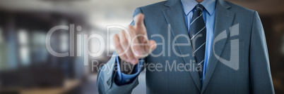 Composite image of midsection of well dressed businessman pointing