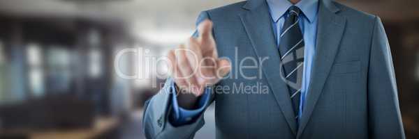 Composite image of midsection of well dressed businessman pointing