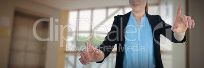 Composite image of young businesswoman working on imaginary interface