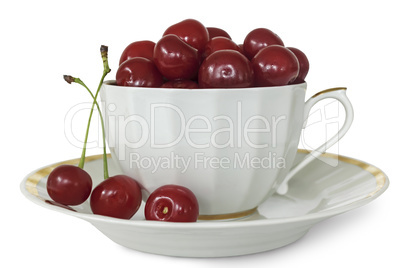 White Cup and saucer with cherries on a white background.