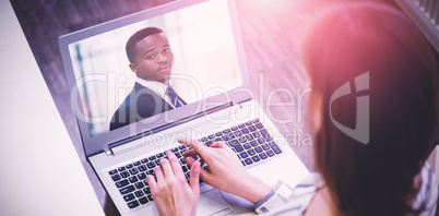 Composite image of rear view of woman working