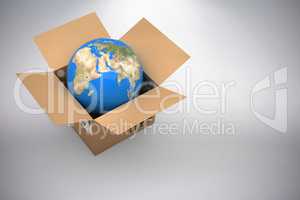 Composite 3d image of vector image of globe in cardboard box