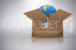 Composite 3d image of graphic image of globe in cardboard box
