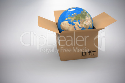 Composite image of 3d image of globe in brown cardboard box