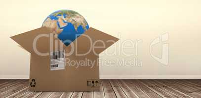 Composite 3d image of digital image of globe in brown cardboard box