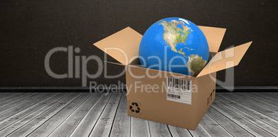 Composite 3d image of computer graphic image of globe in cardboard box
