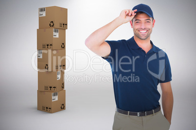 Composite image of portrait of happy delivery man wearing cap