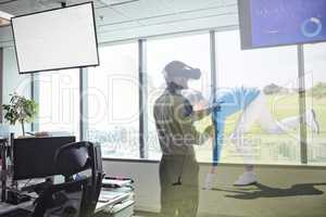 Composite image of business using virtual reality headset by window