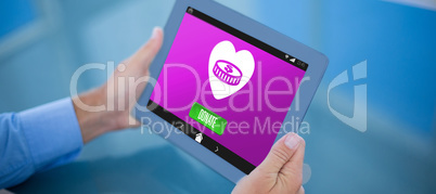 Composite image of businessman using his tablet