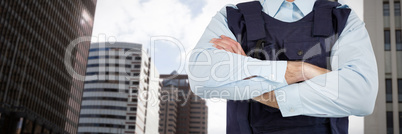 Composite image of mid section of security officer standing with arms crossed