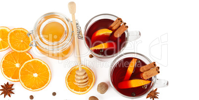 Hot red mulled wine, bee honey, slices of oranges and spices iso