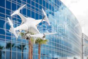 Unmanned Aircraft System (UAS) Quadcopter Drone In The Air Near