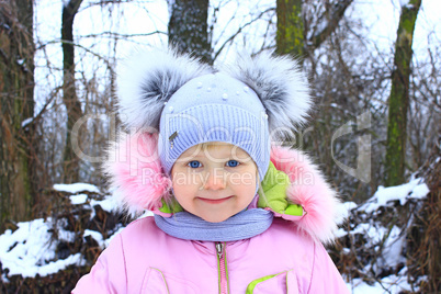Portrait of baby in amusing winter cap