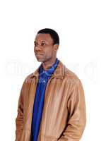 Serious African man standing in leather jacket