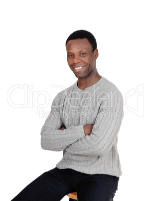 Happy African man smiling, sitting