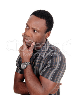 Portrait of thinking African man with hand on chin