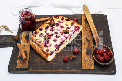 pie from cottage cheese and cherries on a brown board