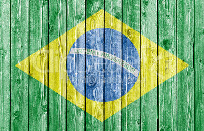 National flag of Brazil on old white wood background