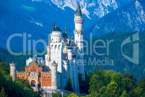 Palace Neuschwanstein Surrounded by Wooded Mountains