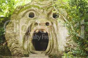 the mouth of the ogre building inside the Park of the Monsters in Bomarzo, Italy